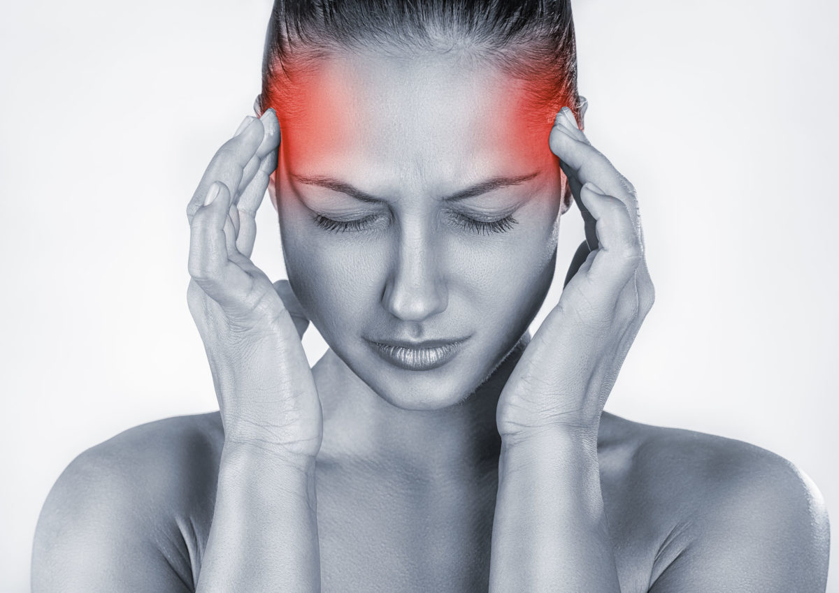 42654958 - woman with headache isolated on white background